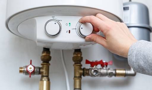 turning the knob of a tankless water heater